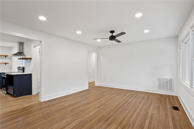 spare room featuring recessed lighting, visible vents, light wood finished floors, and baseboards