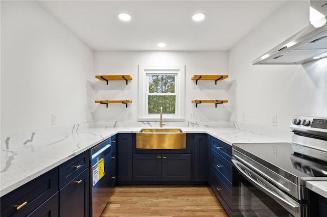 kitchen with open shelves, blue cabinetry, a sink, range hood, and stainless steel appliances