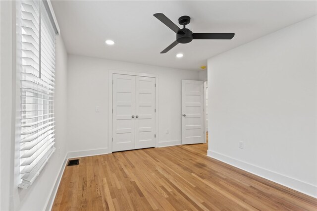 spare room with visible vents, baseboards, a healthy amount of sunlight, and light wood finished floors