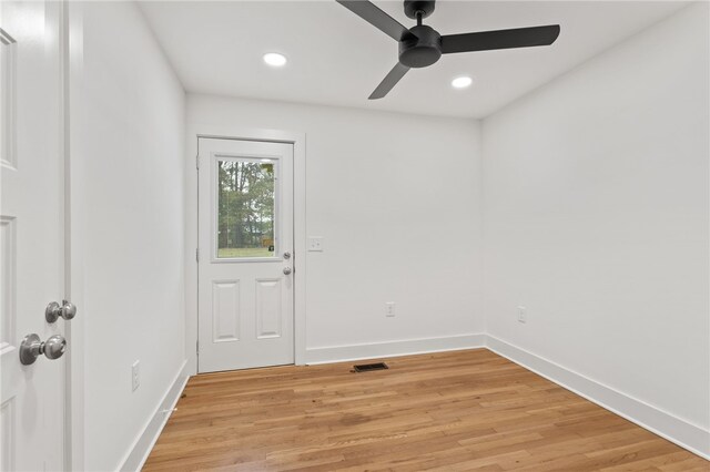 interior space featuring light wood-style flooring, recessed lighting, baseboards, and visible vents