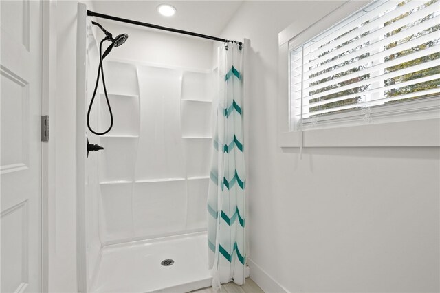 bathroom with a stall shower