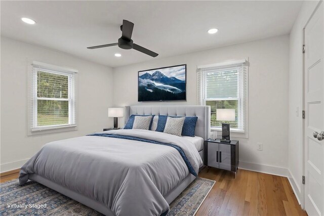 bedroom featuring recessed lighting, ceiling fan, baseboards, and wood finished floors