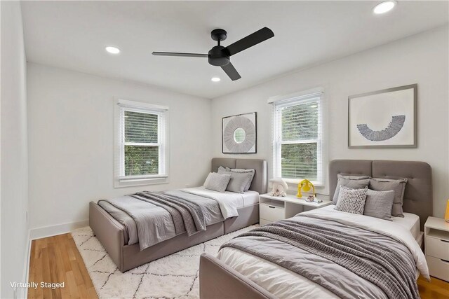 bedroom featuring recessed lighting, baseboards, light wood-style flooring, and a ceiling fan