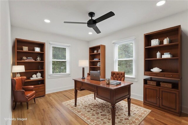 office space with light wood finished floors, recessed lighting, baseboards, and a ceiling fan