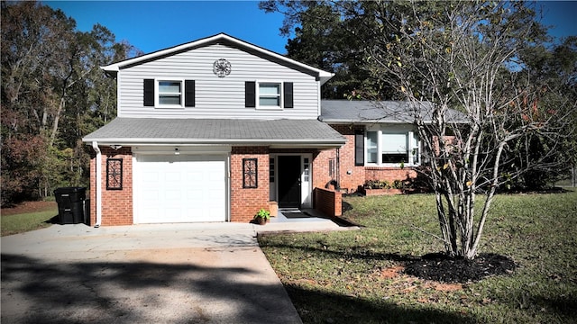 view of front of property with a front lawn and a garage