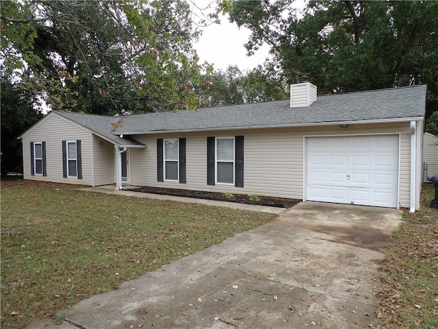 ranch-style home featuring a garage and a front lawn