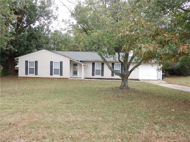 ranch-style house with a garage and a front lawn