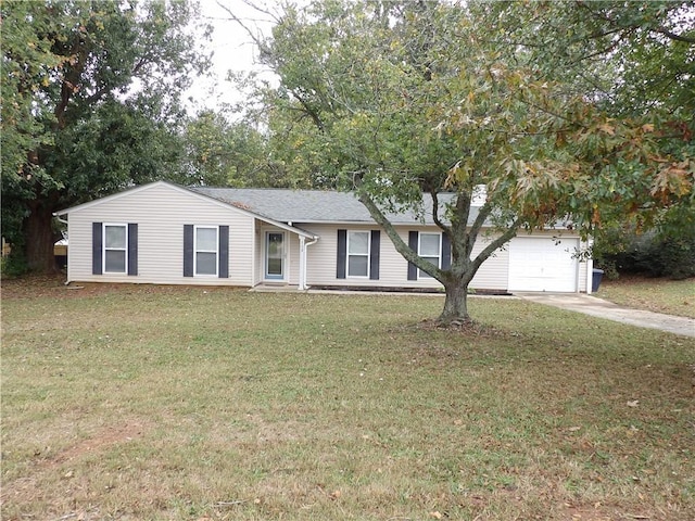 ranch-style home with concrete driveway, a front yard, and a garage