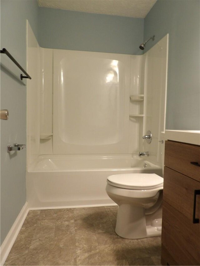 bathroom with shower / tub combination, toilet, and baseboards
