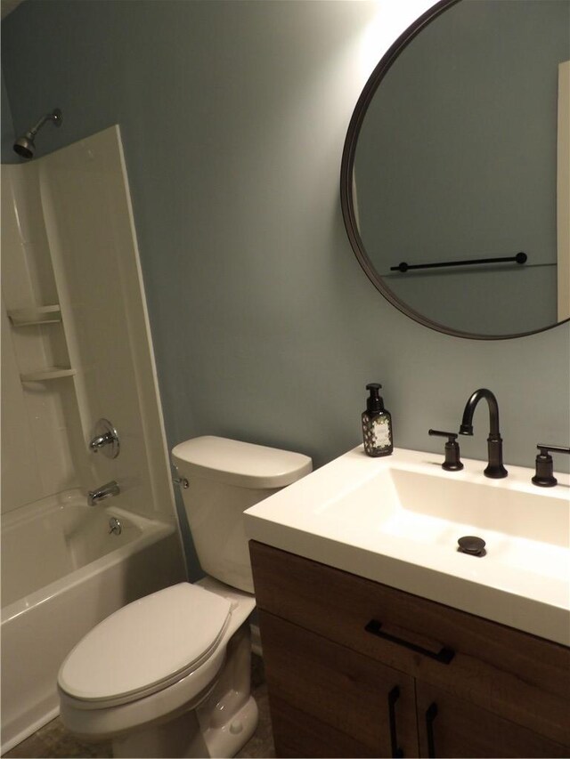 full bath featuring vanity, toilet, and  shower combination