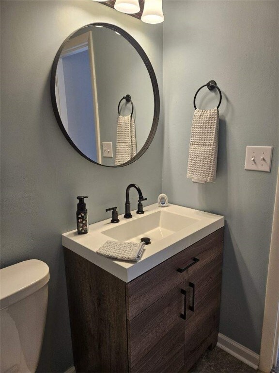 bathroom with vanity and toilet