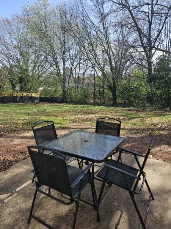 view of patio featuring outdoor dining area