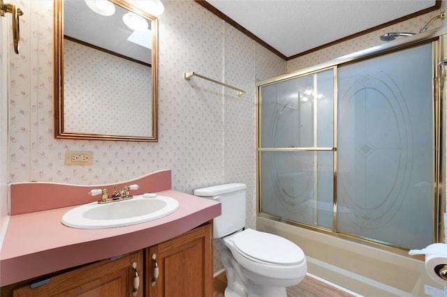 full bathroom featuring a textured ceiling, vanity, crown molding, shower / bath combination with glass door, and toilet