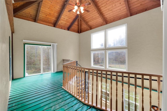 interior space with beamed ceiling, hardwood / wood-style floors, high vaulted ceiling, and wooden ceiling