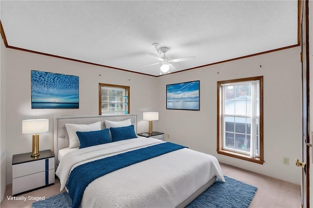 bedroom featuring ceiling fan, ornamental molding, and light carpet