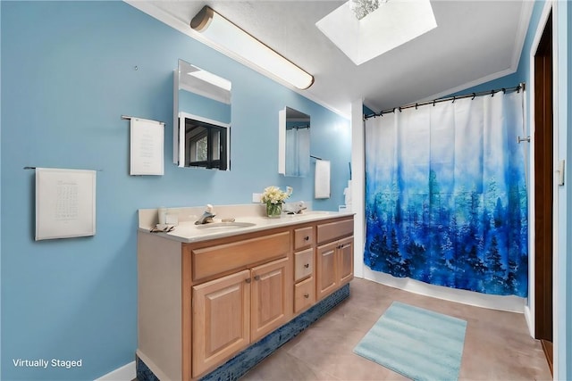 bathroom featuring vanity, a skylight, walk in shower, and crown molding