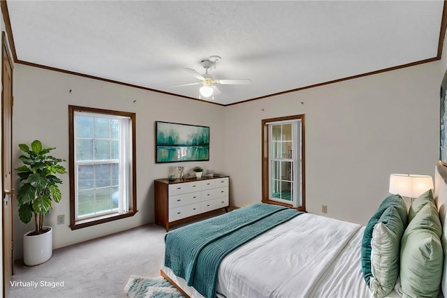 bedroom with light carpet, ceiling fan, and ornamental molding