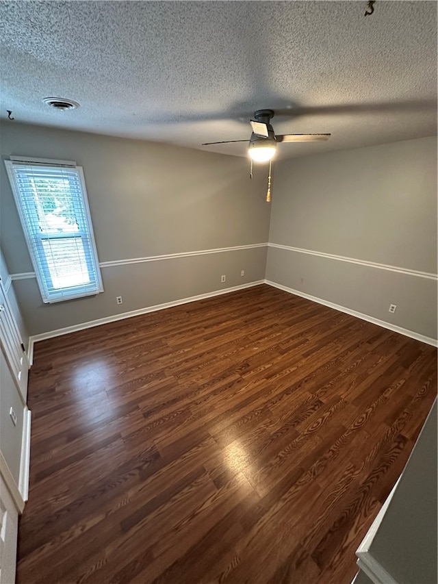 spare room with hardwood / wood-style flooring