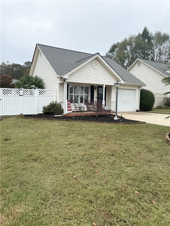 view of front of house with a garage and a front yard