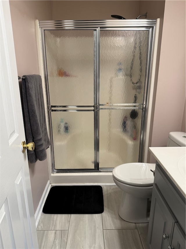 bathroom with a shower with door