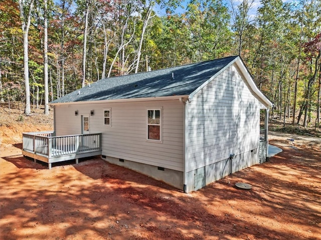 view of property exterior featuring a wooden deck