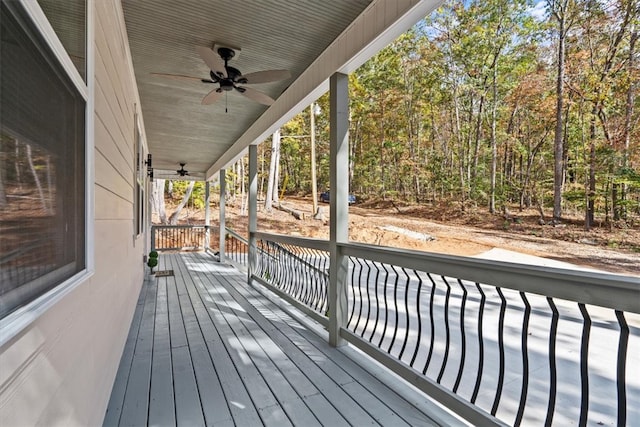 wooden terrace featuring ceiling fan