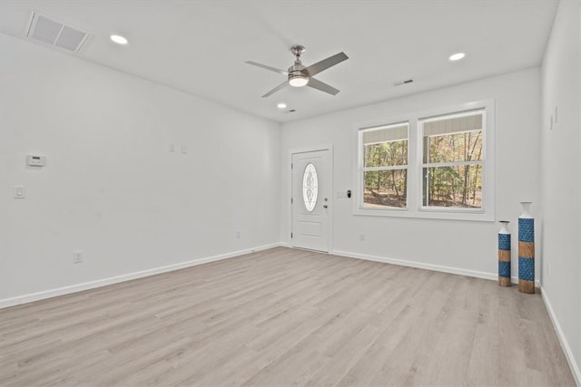 unfurnished room featuring light wood-type flooring and ceiling fan