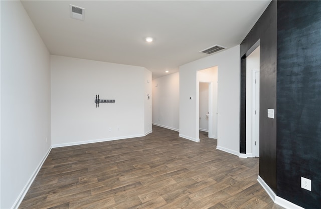 empty room featuring dark hardwood / wood-style flooring