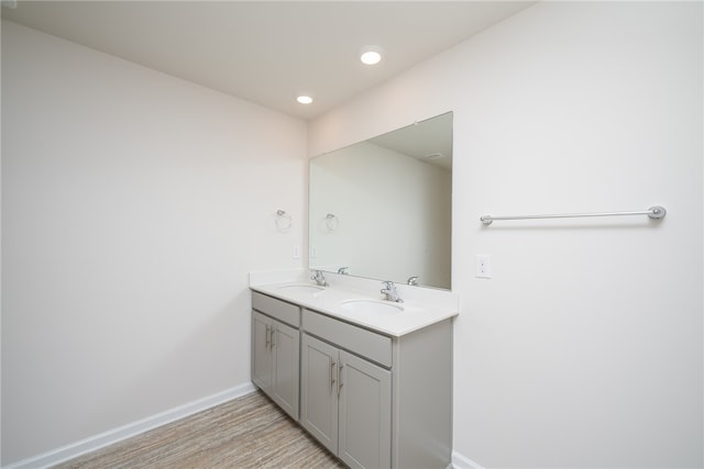 bathroom with vanity and wood-type flooring