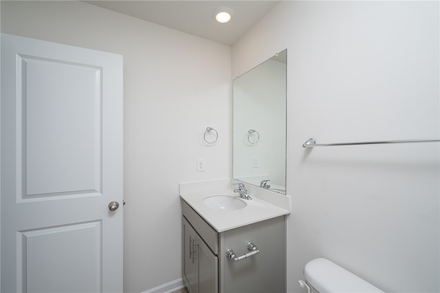 bathroom with toilet and vanity