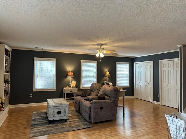 living room with hardwood / wood-style flooring and a wealth of natural light