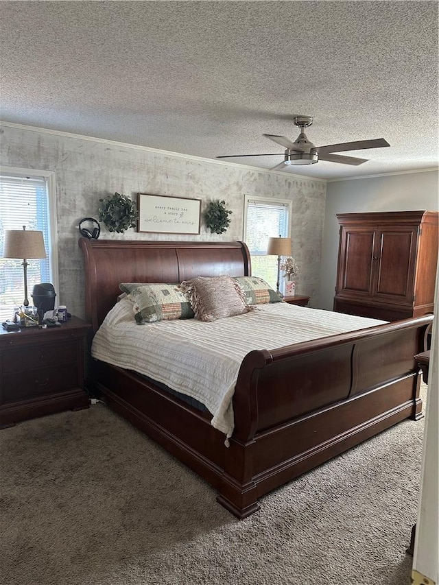 bedroom with carpet, ceiling fan, a textured ceiling, and multiple windows