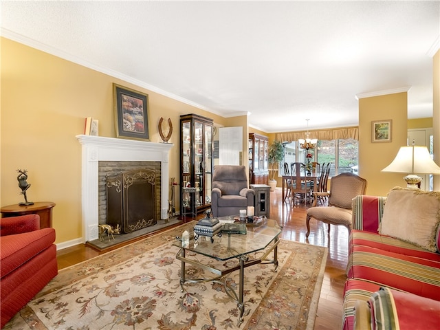 living room with a fireplace, wood-type flooring, and crown molding