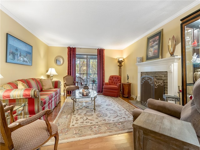 living room featuring ornamental molding and light hardwood / wood-style floors