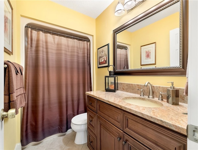 bathroom with a shower with shower curtain, a textured ceiling, vanity, tile patterned floors, and toilet