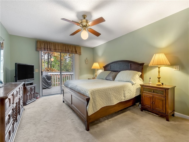 carpeted bedroom featuring a textured ceiling, access to outside, and ceiling fan