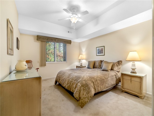 bedroom featuring light colored carpet and ceiling fan