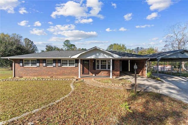 ranch-style house featuring a carport and a front yard