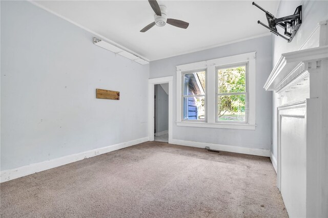 interior space with carpet floors and ceiling fan