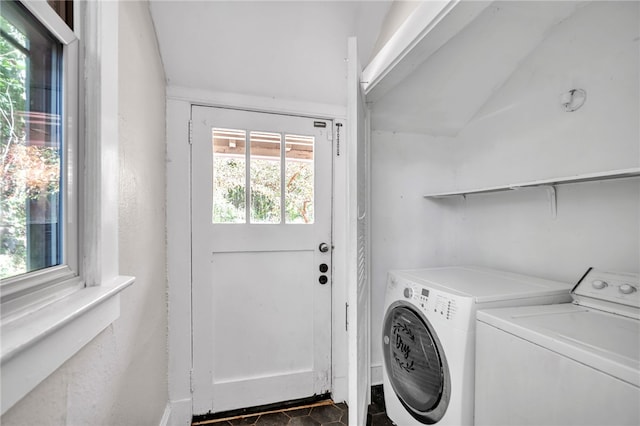 clothes washing area with washer and clothes dryer