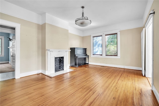 unfurnished living room with hardwood / wood-style flooring