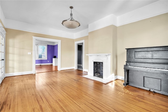 unfurnished living room featuring hardwood / wood-style flooring