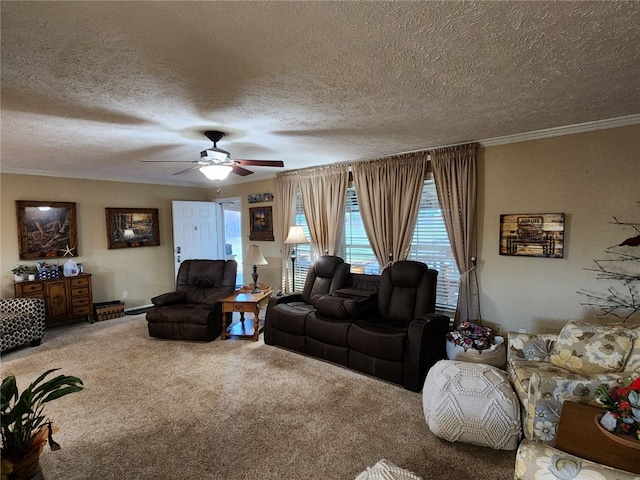 living room featuring ceiling fan, a textured ceiling, carpet floors, and crown molding