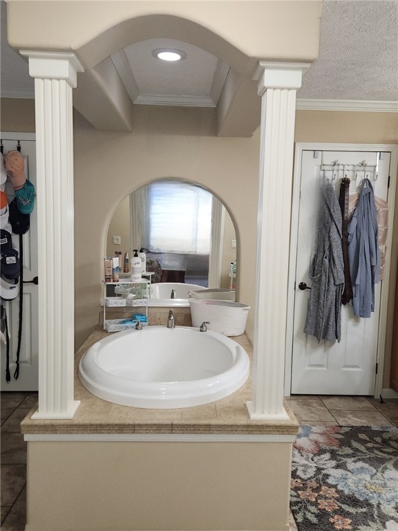 bathroom with decorative columns, vanity, tile patterned floors, and ornamental molding