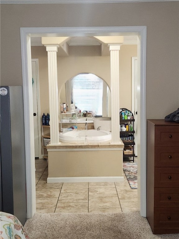 bathroom featuring tile patterned floors and ornate columns