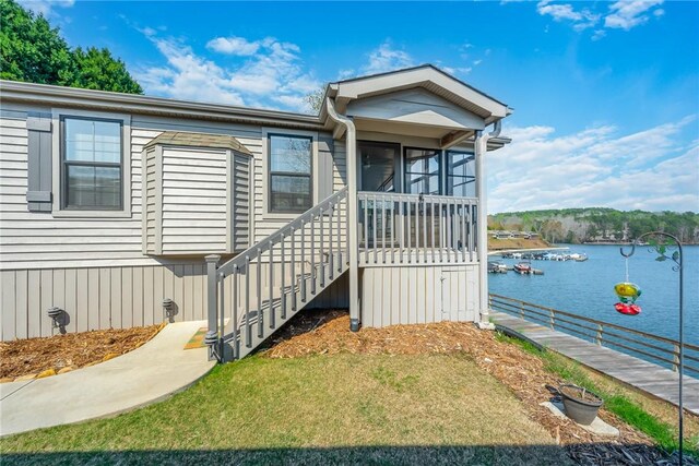 1230 Melton Rd Unit 31, West Union, SC 29696 - view of front of property featuring a water view, a sunroom, stairs, and a front lawn