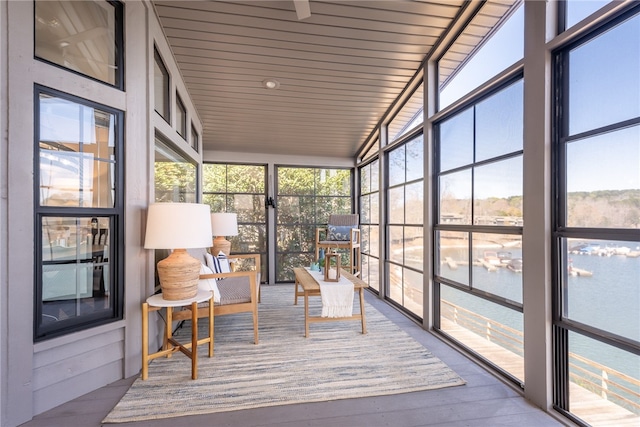 sunroom with wooden ceiling and vaulted ceiling