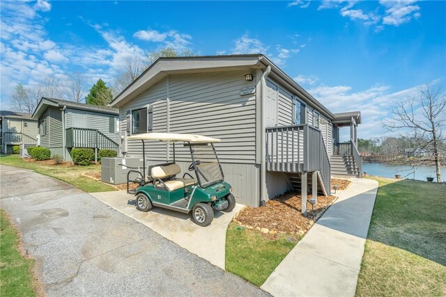 1230 Melton Rd Unit 31, West Union, SC 29696 - view of side of home featuring a lawn and a water view