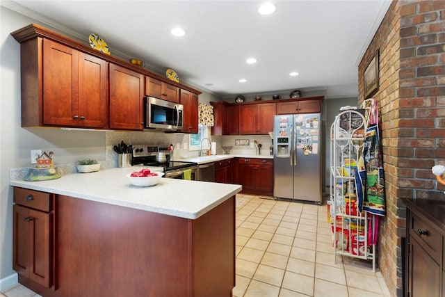 kitchen featuring kitchen peninsula, appliances with stainless steel finishes, crown molding, sink, and light tile patterned floors