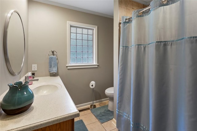 bathroom with tile patterned flooring, vanity, toilet, and ornamental molding